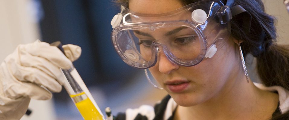 Student analyzing results in a Chemistry lab.
